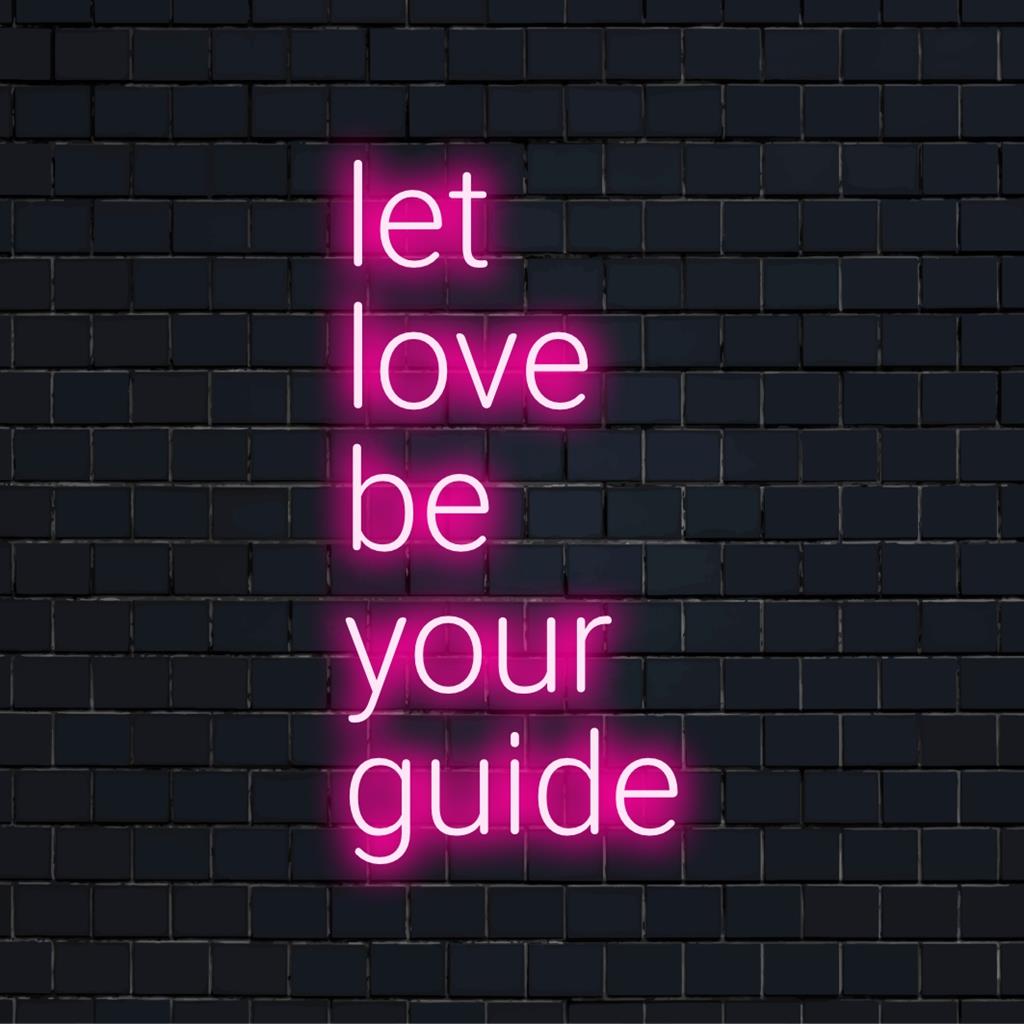 Levande LED-neonskylt med texten Låt kärleken vara din guide, blandar konst och ljus för att lysa upp utrymmen med positiv energi.
