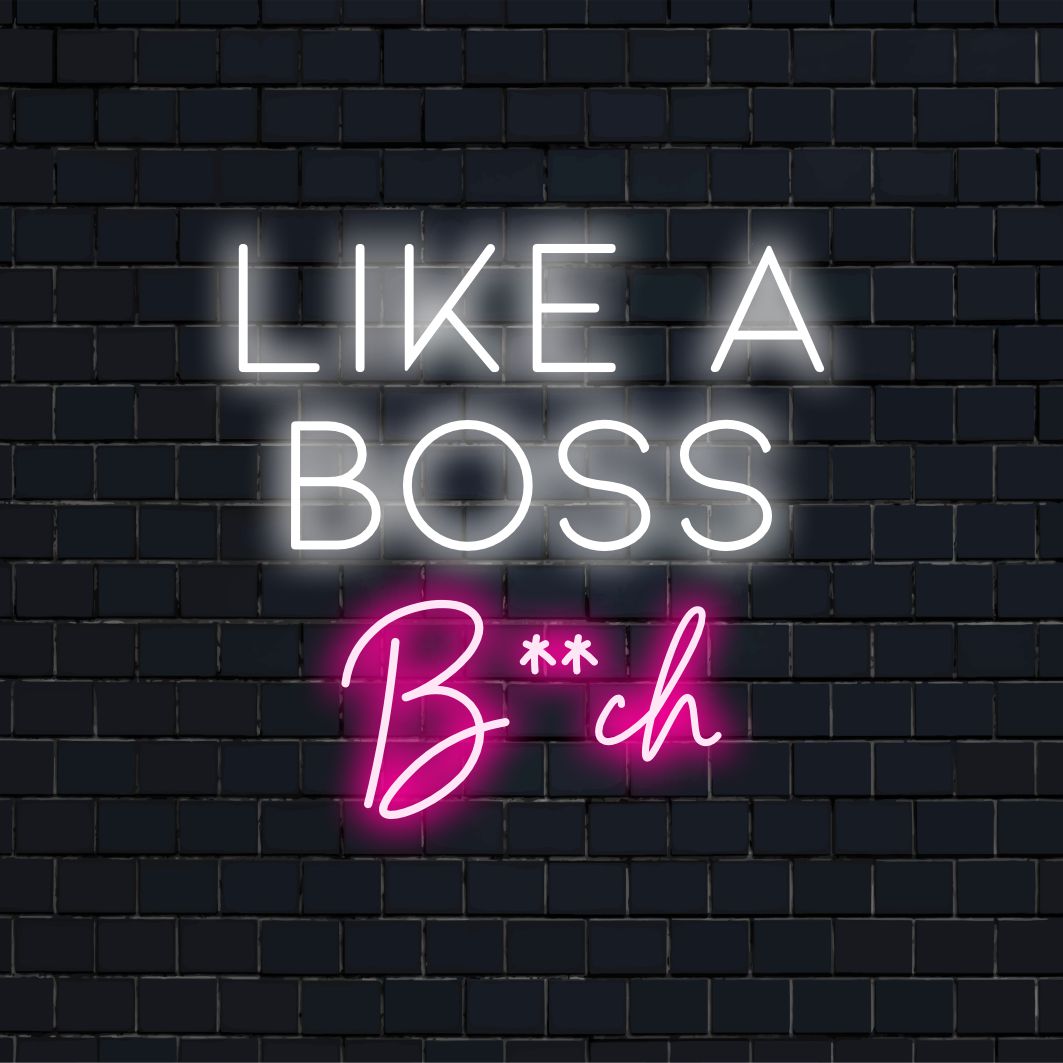Mukautettu LED-neonkyltti lihavoitulla tekstillä: Like A Boss Bitch, valaisee tiloja eloisilla neonvaloilla.