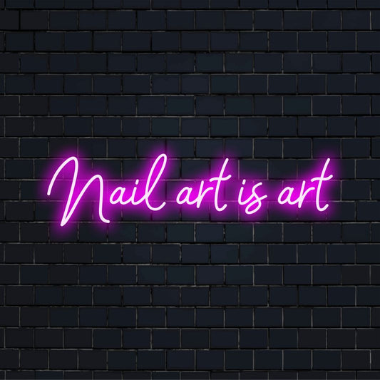 LED neon sign reading Nail Art Is Art, perfect for salons; a striking pink glow adds flair to any beauty space.