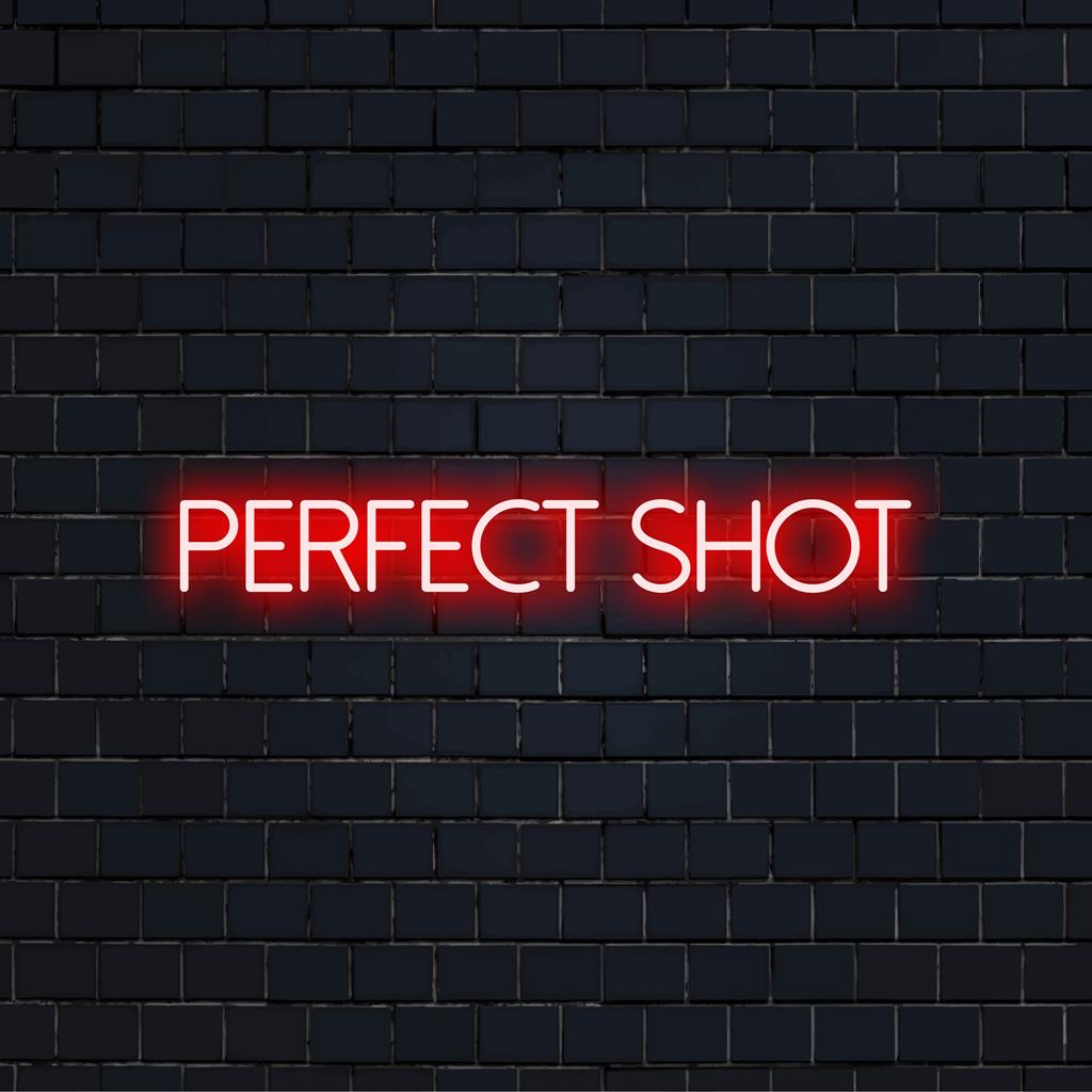 Vibrant LED neon sign displaying Perfect Shot, ideal for adding a custom flair to any space; highlights personalized neon design.