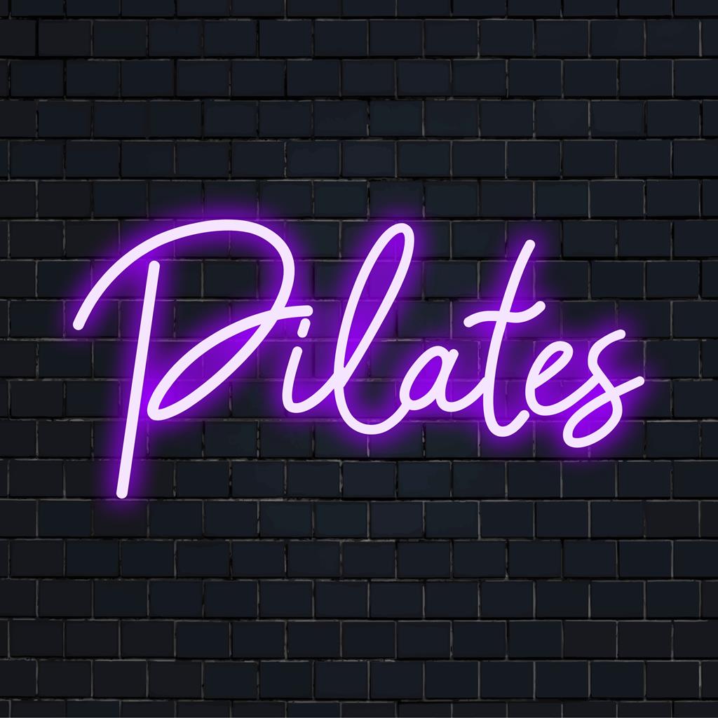 LED neon sign featuring Pilates in flowing text, ideal for studios; a sleek neon accent and personalized wall art decor.