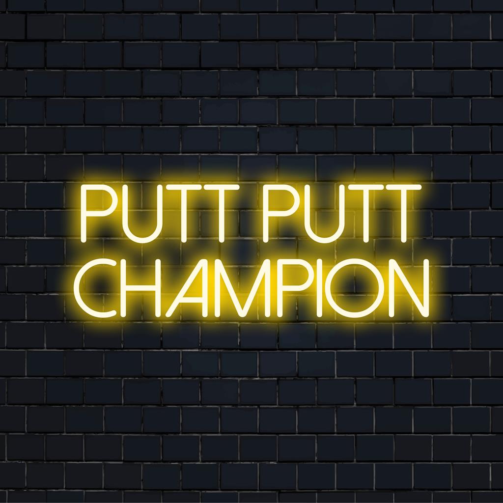 LED-valokyltti, jossa lukee Putt Putt Champion, täydellinen lisäämään leikkisää ja persoonallista ilmettä tilaan.