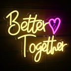 The image displays a vivid and eye-catching LED neon sign shaped like a heart.