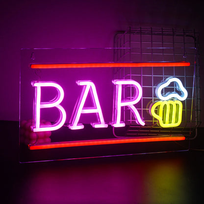 The image features a vibrant LED neon sign that spells out the word "Bar" in bright, eye-catching letters.