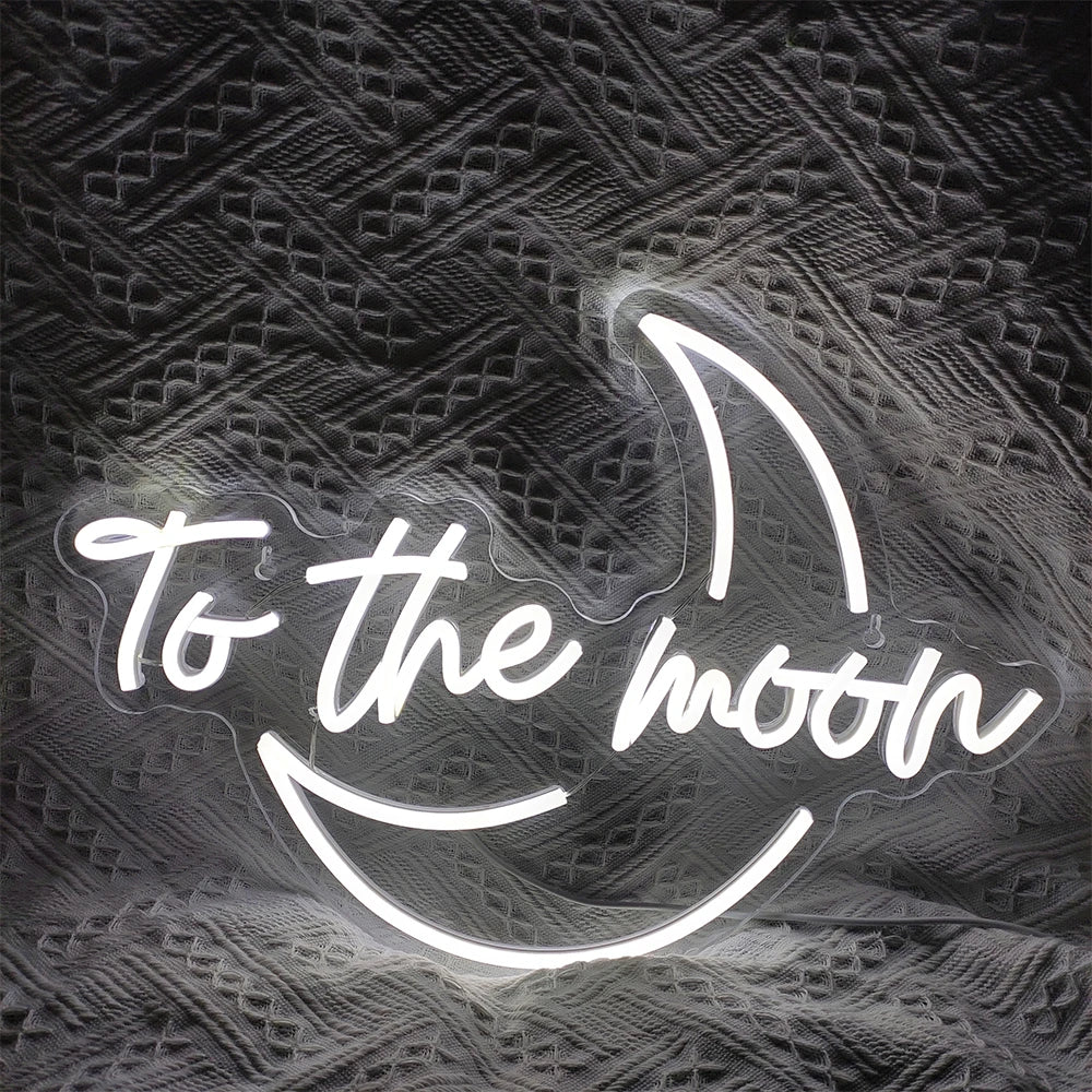 A vibrant LED neon sign displaying the phrase "To The Moon" in a sleek, modern font.