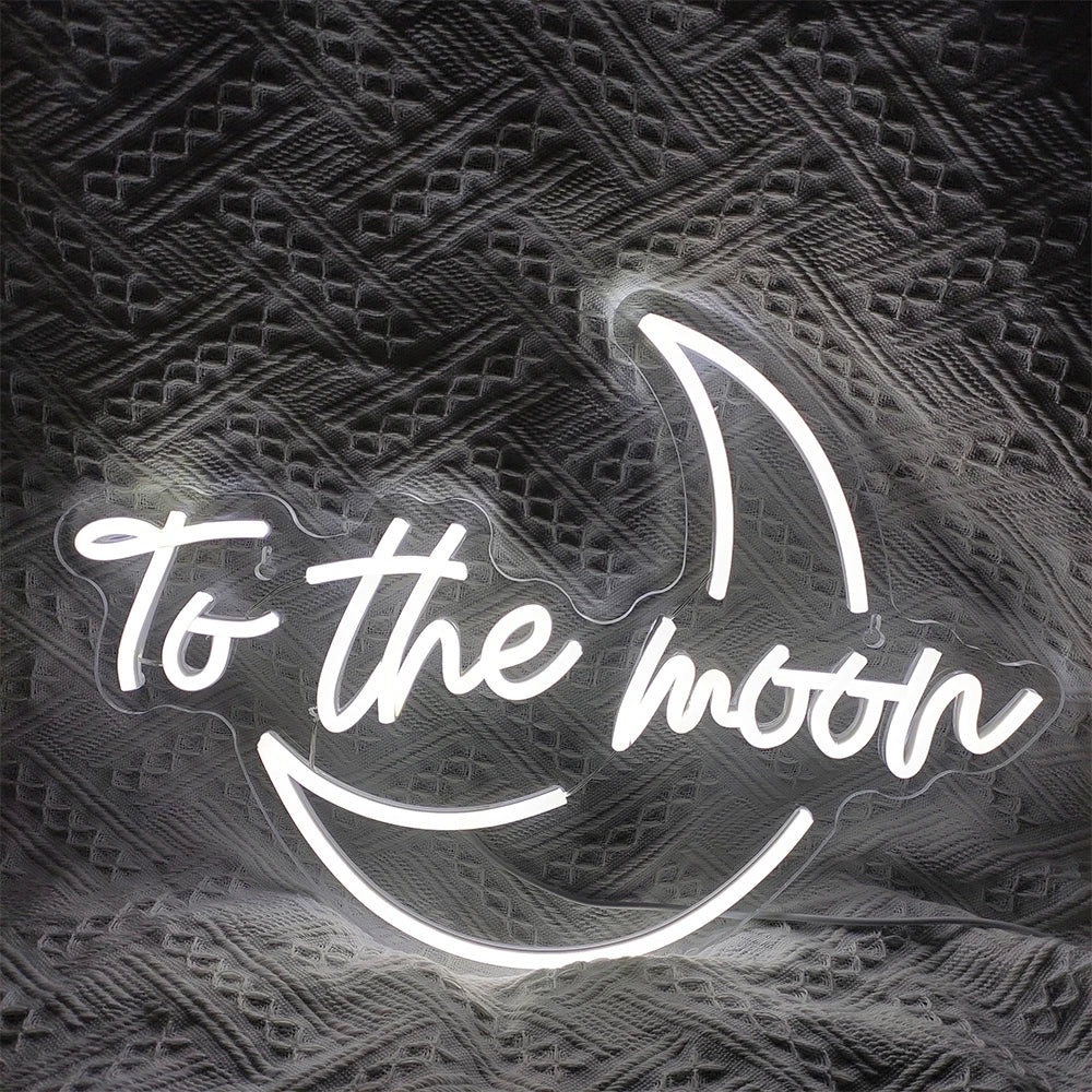 Eloisa LED-valokyltti, jossa on ilmaus "To The Moon" tyylikkäällä ja modernilla fontilla.