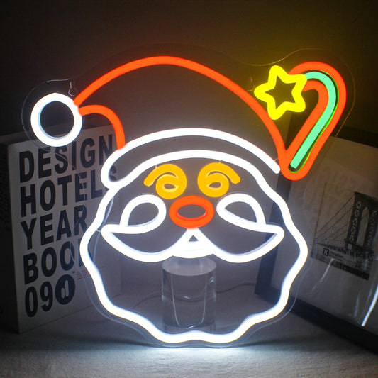 A vibrant Christmas-themed LED neon sign featuring an array of festive symbols illuminated in bright colors.