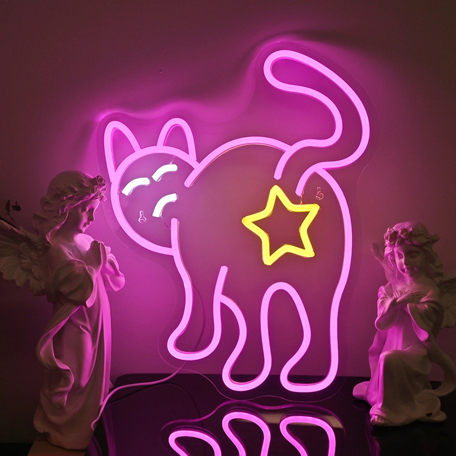 The image shows a cat-shaped LED neon sign emitting a warm, yellow glow.