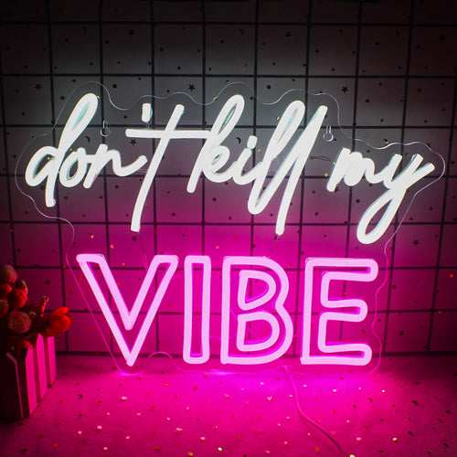 Bilden har en levande LED-neonskylt som visar frasen "Don't Kill My Vibe" i ett stilfullt kursivt teckensnitt.