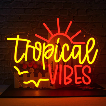 An image showcasing a glowing LED neon sign that spells out "Tropical Vibes" in vibrant colors.