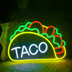 Kuvassa on eloisa LED-valokyltti, joka on muotoiltu kirjoittamaan sana "Tacos.