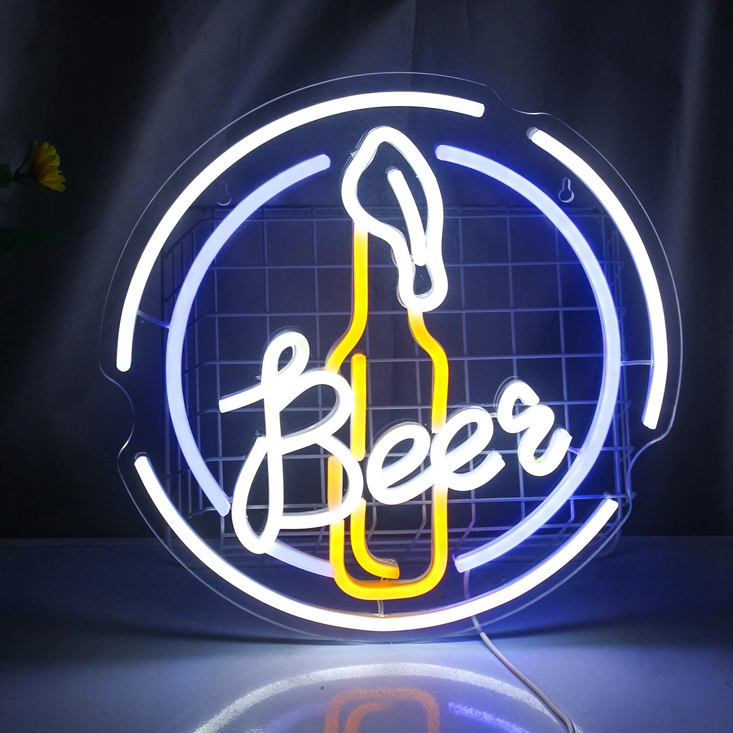 The image features a vibrant LED neon sign, shaped like a glowing beer mug with frothy foam on top.