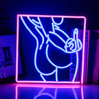 The image features a handmade LED neon sign depicting the silhouette of a woman’s body in a stylish and sensual pose.