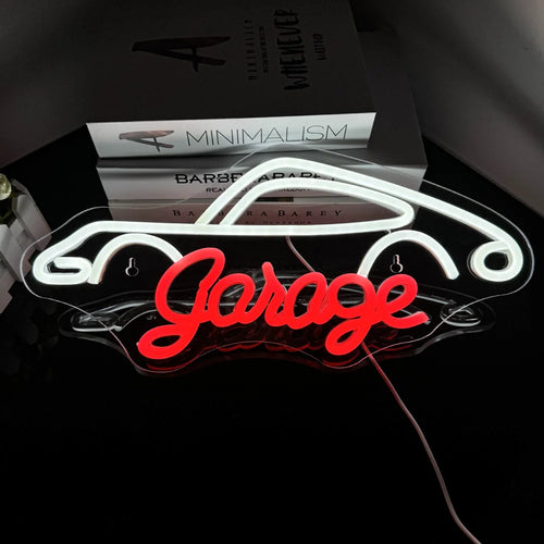 Kuvassa on eloisa LED-valokyltti, jossa on sana "Garage" lihavoitulla ja tyylikkäällä fontilla.