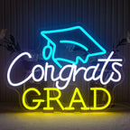 A brightly lit neon sign that reads "Congrats Grad" in a sleek, modern font.