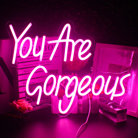 A vibrant and stylish LED neon sign displaying the phrase "You Are Gorgeous" in elegant, flowing script.