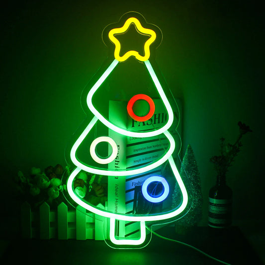 A festive Christmas Tree LED neon sign glows brightly against a dark background.