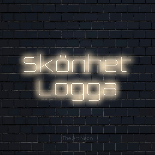 Personlig neonskylt med texten “Skönhet Logga” på en svart tegelvägg