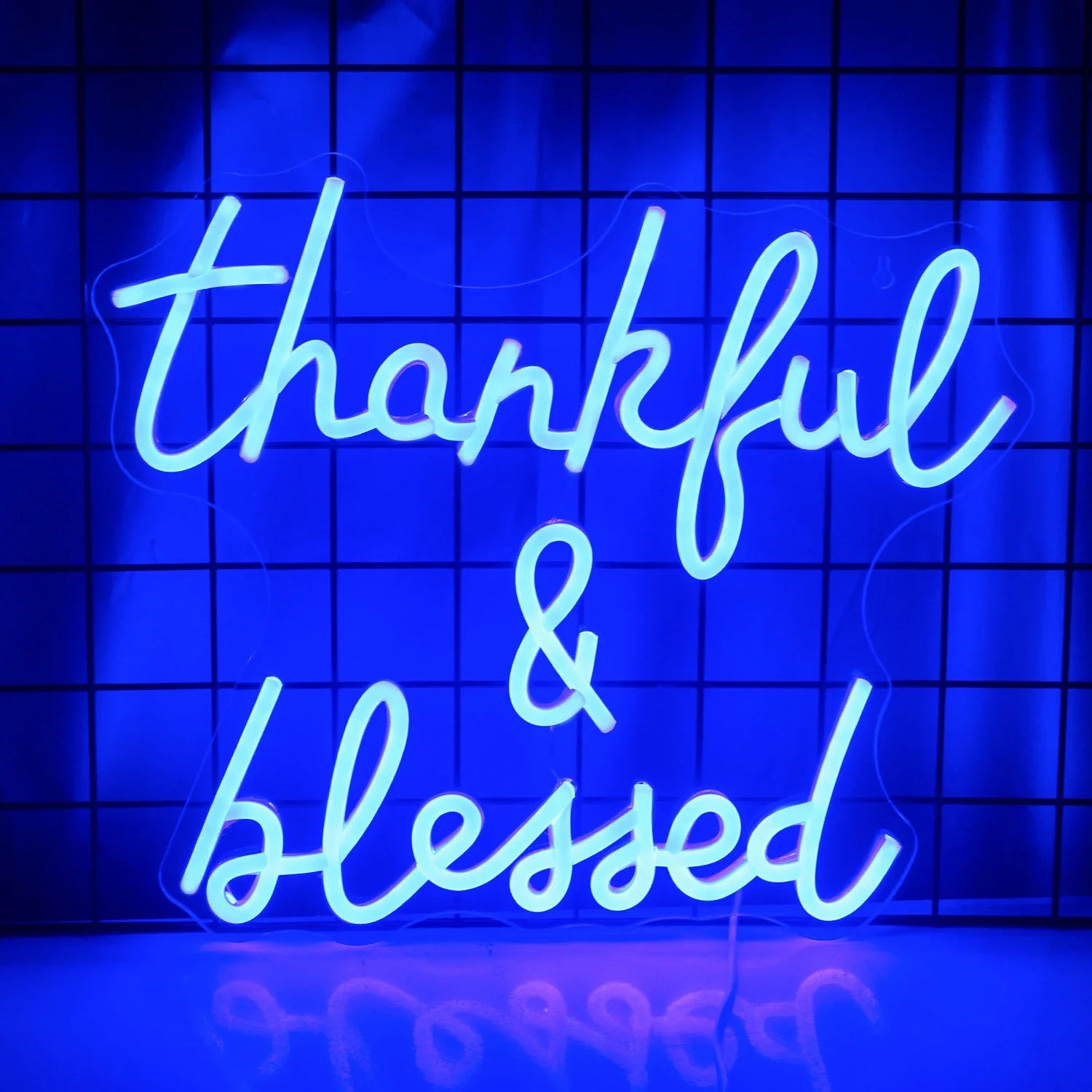 The image showcases a vibrant "Thankful and Blessed" LED neon sign.