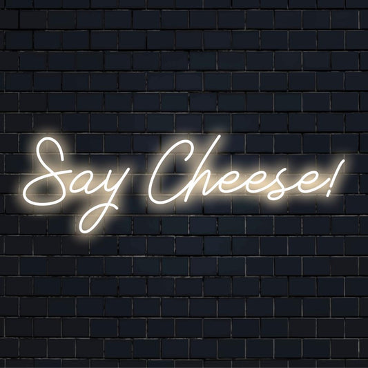 Vibrant neon sign with a playful 'Say Cheese!' phrase; perfect for adding a custom LED touch to your decor space.