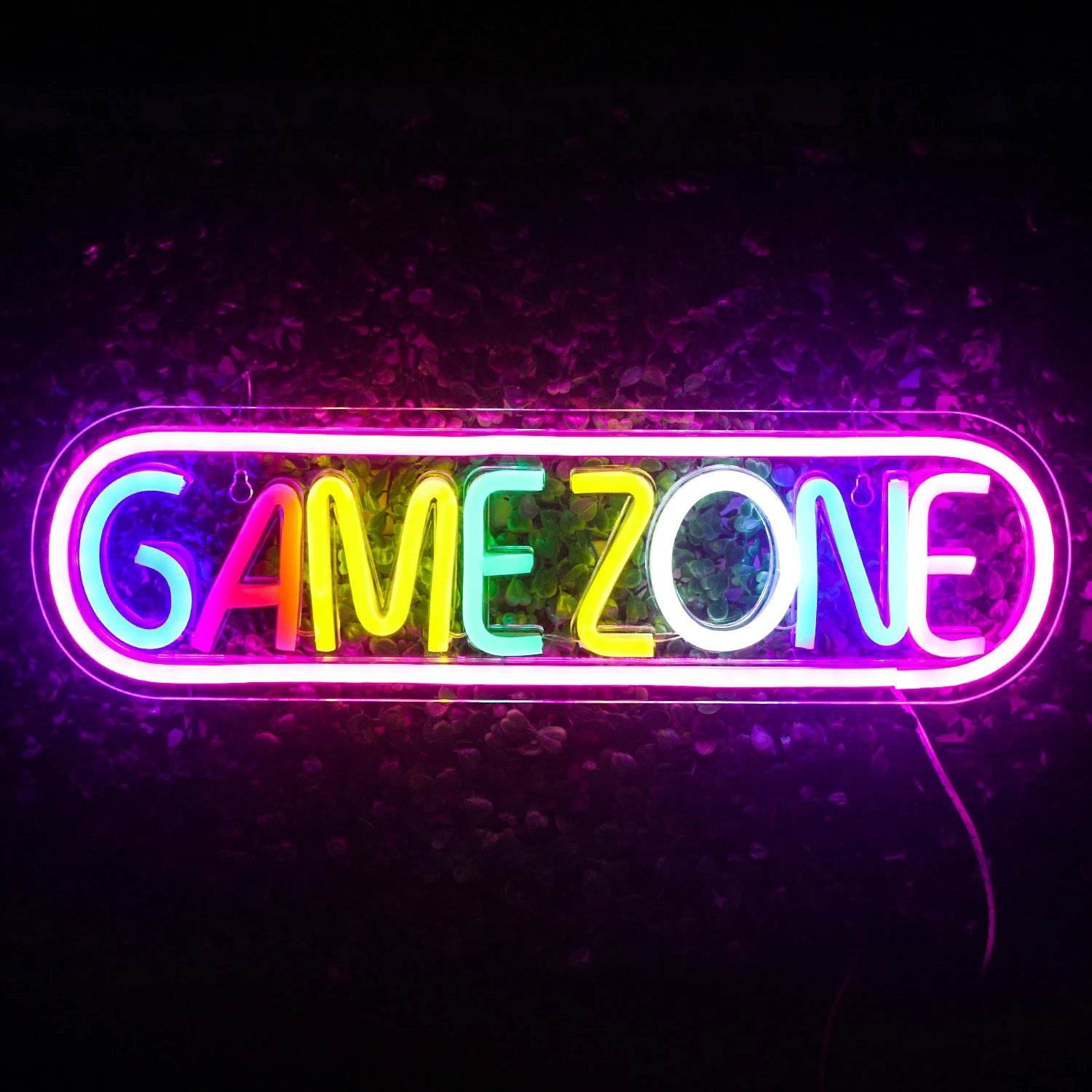 The image displays a vibrant, colorful LED neon sign that reads "Game Zone" in bold, eye-catching letters.