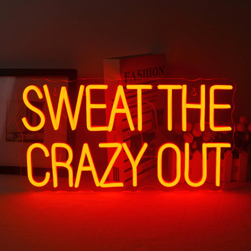 Eloisa LED-valokyltti, jossa on teksti "Sweat The Crazy Out" leikkisällä kursiivikirjasimella.