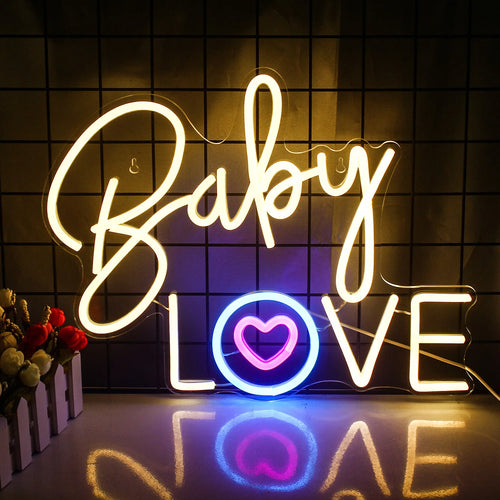 Eloisa vaaleanpunainen neonkyltti kirjoittelee sanat "Baby Love" leikkisällä, kursiivisella fontilla.