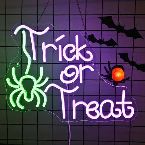 Kuvassa näkyy eloisa "Trick Or Treat" -LED-neonkyltti, joka on muotoiltu leikkisillä, huomiota herättävillä fonteilla.