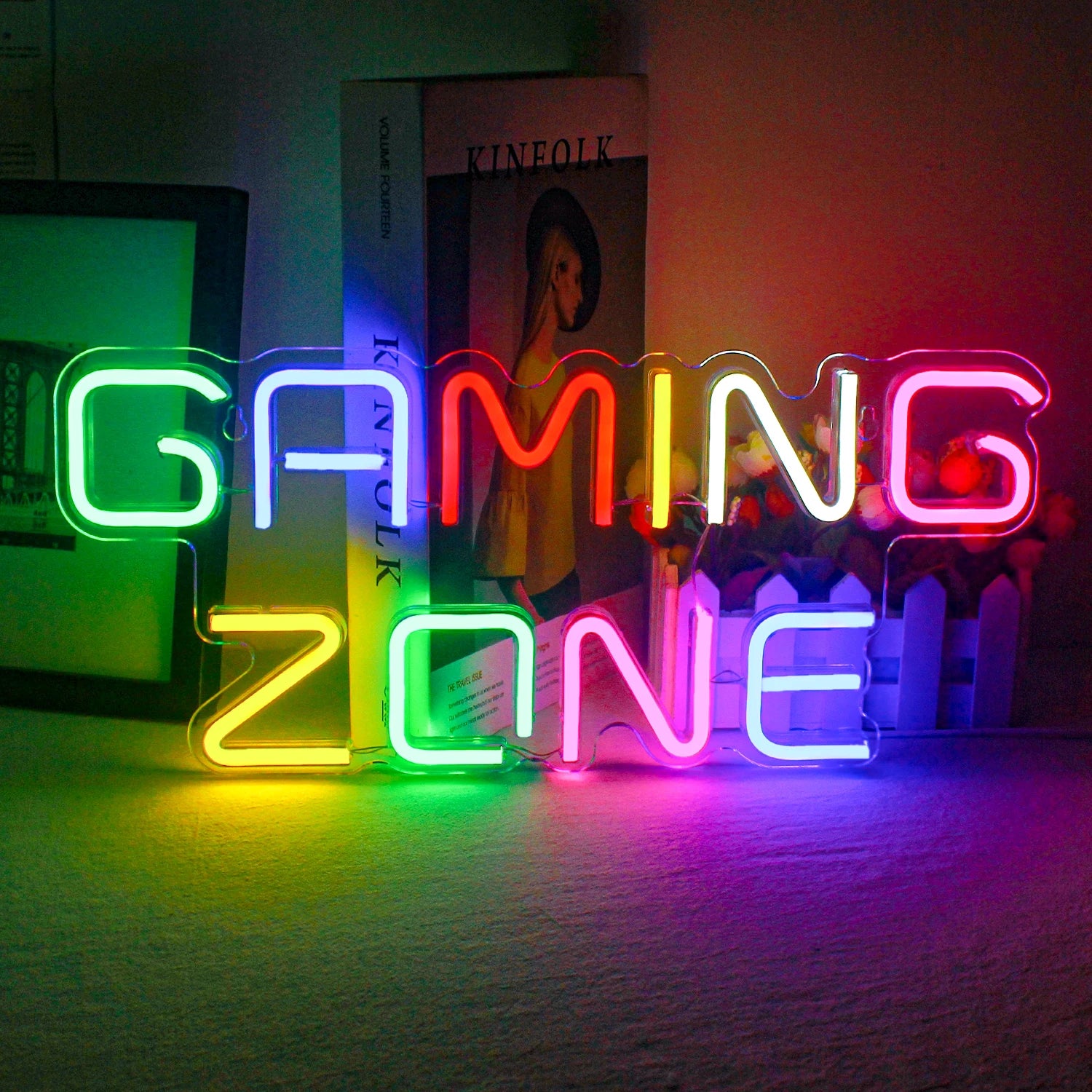 The image showcases a vibrant LED neon sign that spells out "Gaming Zone.