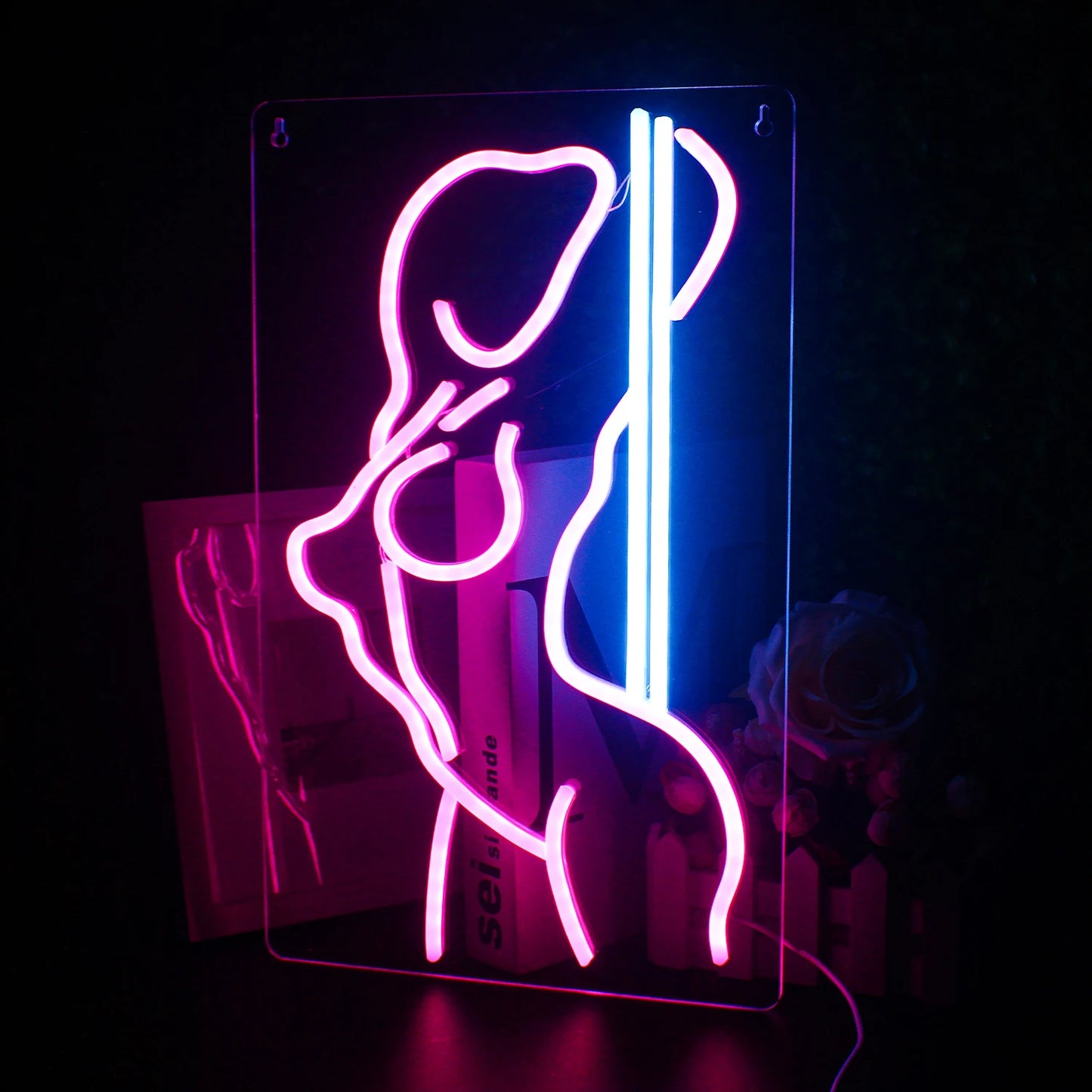 This image shows a vibrant LED neon sign that spells out "Sexy Girls" in bold, cursive lettering.