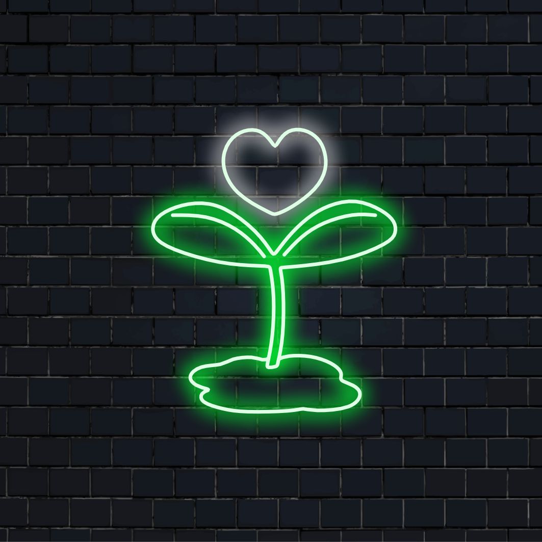 "Sprout and Heart Neon Sign" yhdistää luonnon raikkautta sydämelliseen lämpöön, luoden säteilevän hehkun kasvun ja rakkauden ilmapiiriin tilaan.