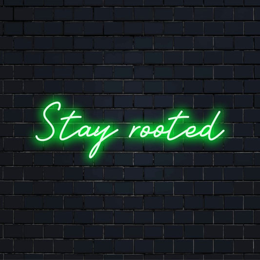 Vibrant Stay Rooted custom LED neon sign glowing in white, perfect as personalized neon home decor or striking wall art.