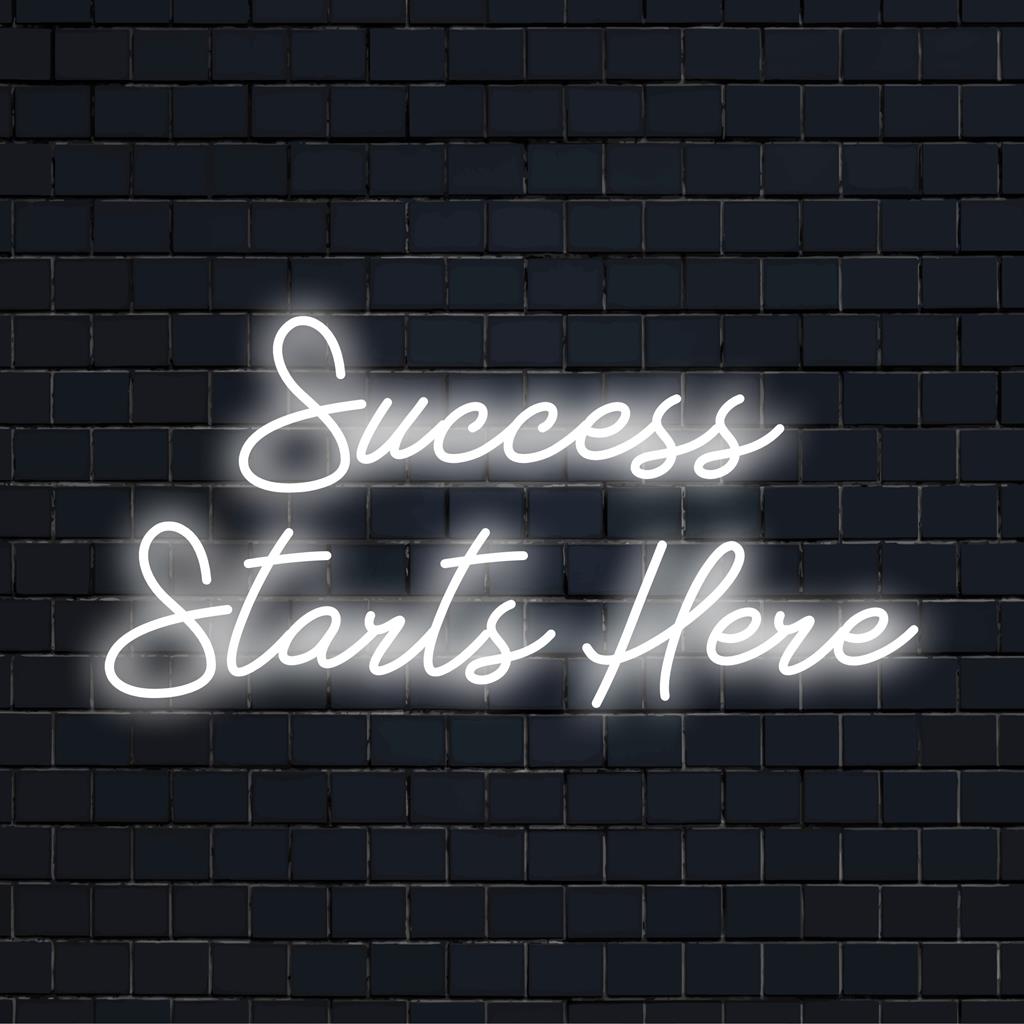 Success Starts Here' neon sign aglow, perfect custom LED quote piece for inspirational decor. Transform any space!