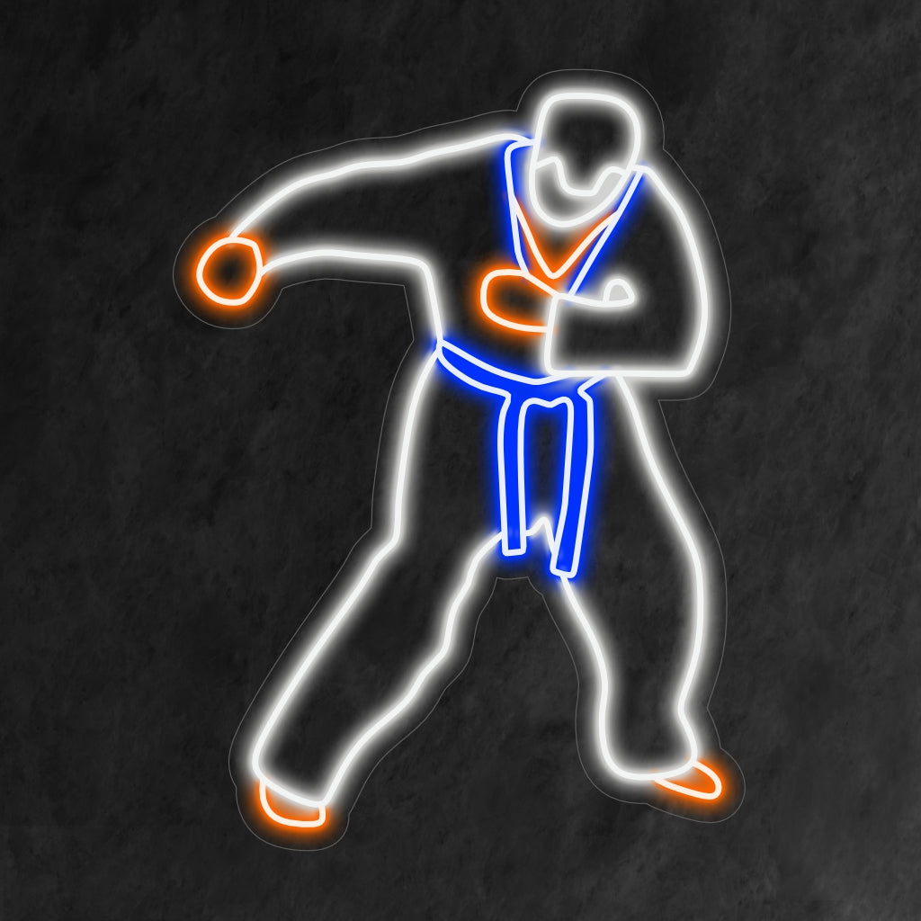 "Taekwondo Neon Sign" ilmentää kamppailulajin dynaamisuutta voimakkaalla hehkullaan, joka juhlii kurinalaisuutta ja voimaa.