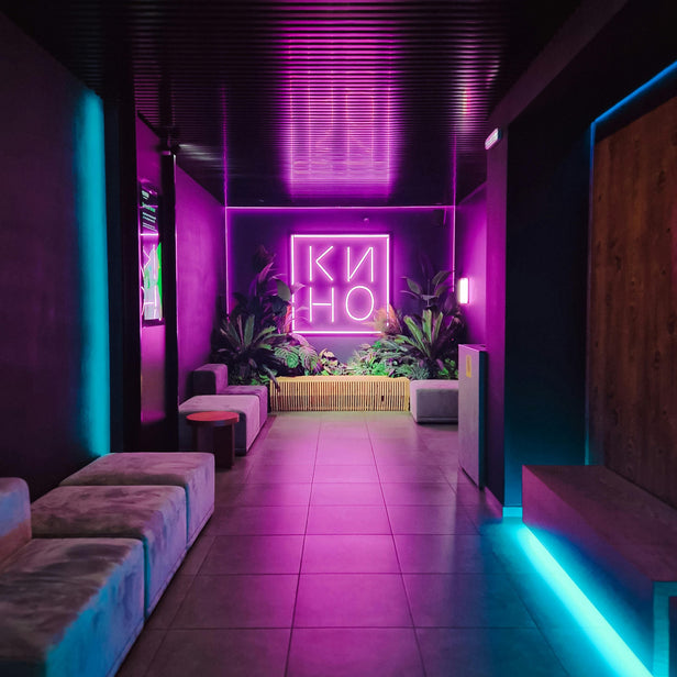 Modern interior with neon lights and 'Kino' sign