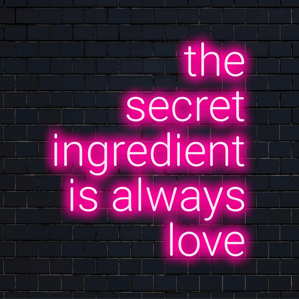 Mukautettu LED-neonkyltti, jossa The Secret Ingredient Is Always Love vangitsevassa kursiivisessa muodossa, sopii täydellisesti mihin tahansa seinäkoristeeseen.