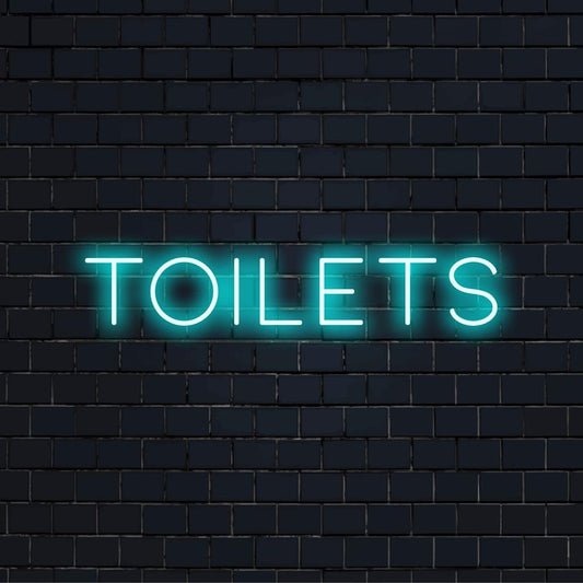 Mukautettu LED-valokyltti, jossa sana WC:t kirkkaalla, tyylikkäällä fontilla; ihanteellinen ainutlaatuiseksi neonsisustusmateriaaliksi.