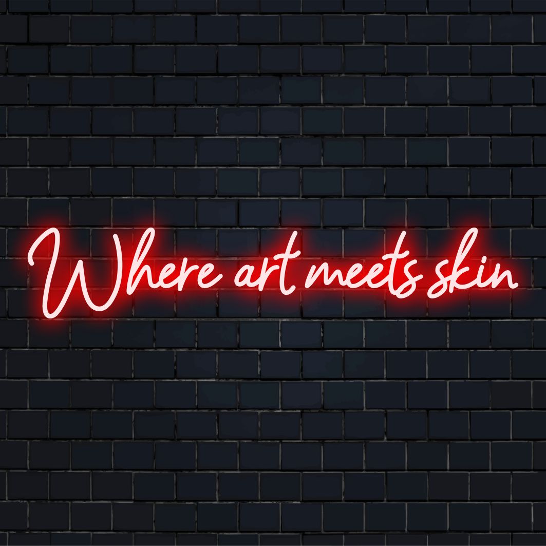 Levande LED-neonskylt med texten Where Art Meets Skin ��� ett anpassat mästerverk som blandar konst med lysande dekor.