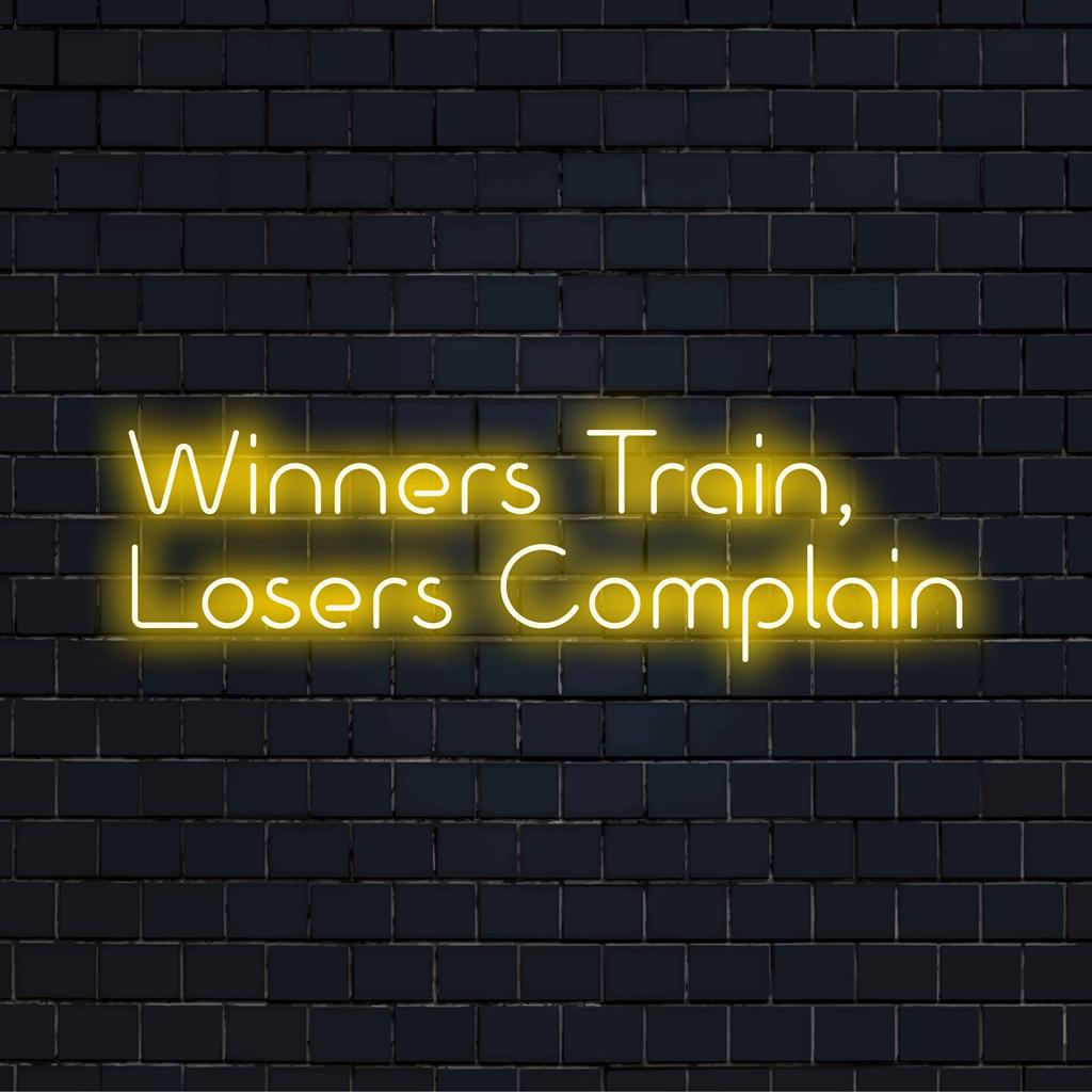 Vibrant neon sign featuring Winners Train, Losers Complain with a cool glow; ideal for motivation-driven LED decor.