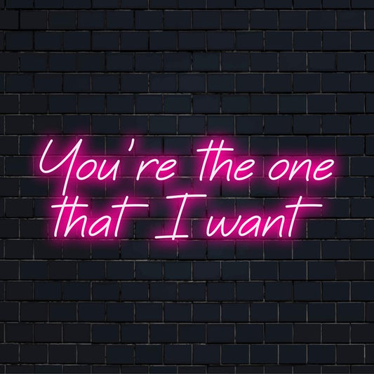 Mittatilaustyönä valmistettu LED-valokyltti, joka esittelee You're The One That I Want elegantilla käsikirjoituksella, ihanteellinen yksilölliseen neonsisustukseen.