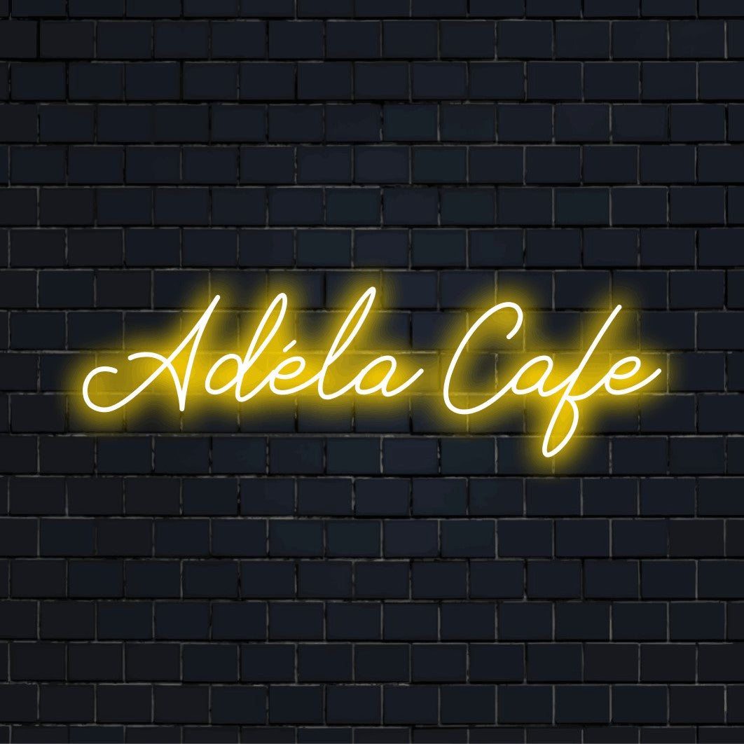 Adela Cafe Personalized LED Neon Sign, bright LED glow on dark brick background