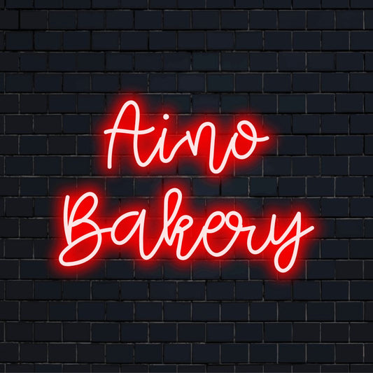 Aino Bakery Custom Name Neon Sign, bright neon glow against brick backdrop