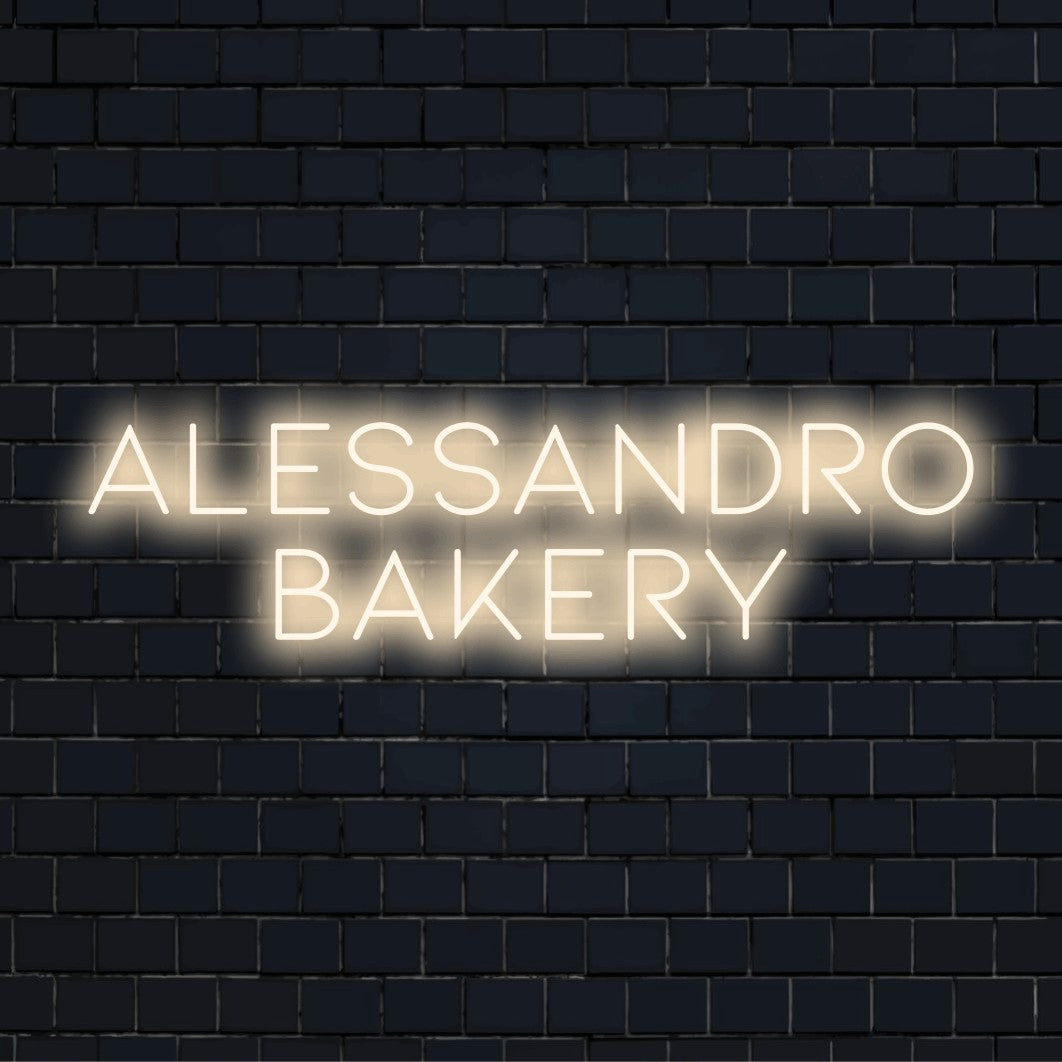 Alessandro Bakery Custom Name Neon Sign, neon text light against brick backdrop