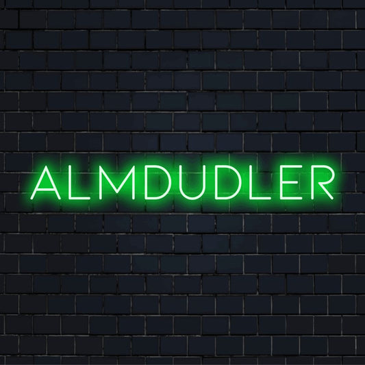 Almdudler Neon Light with glowing lettering against black brick wall
