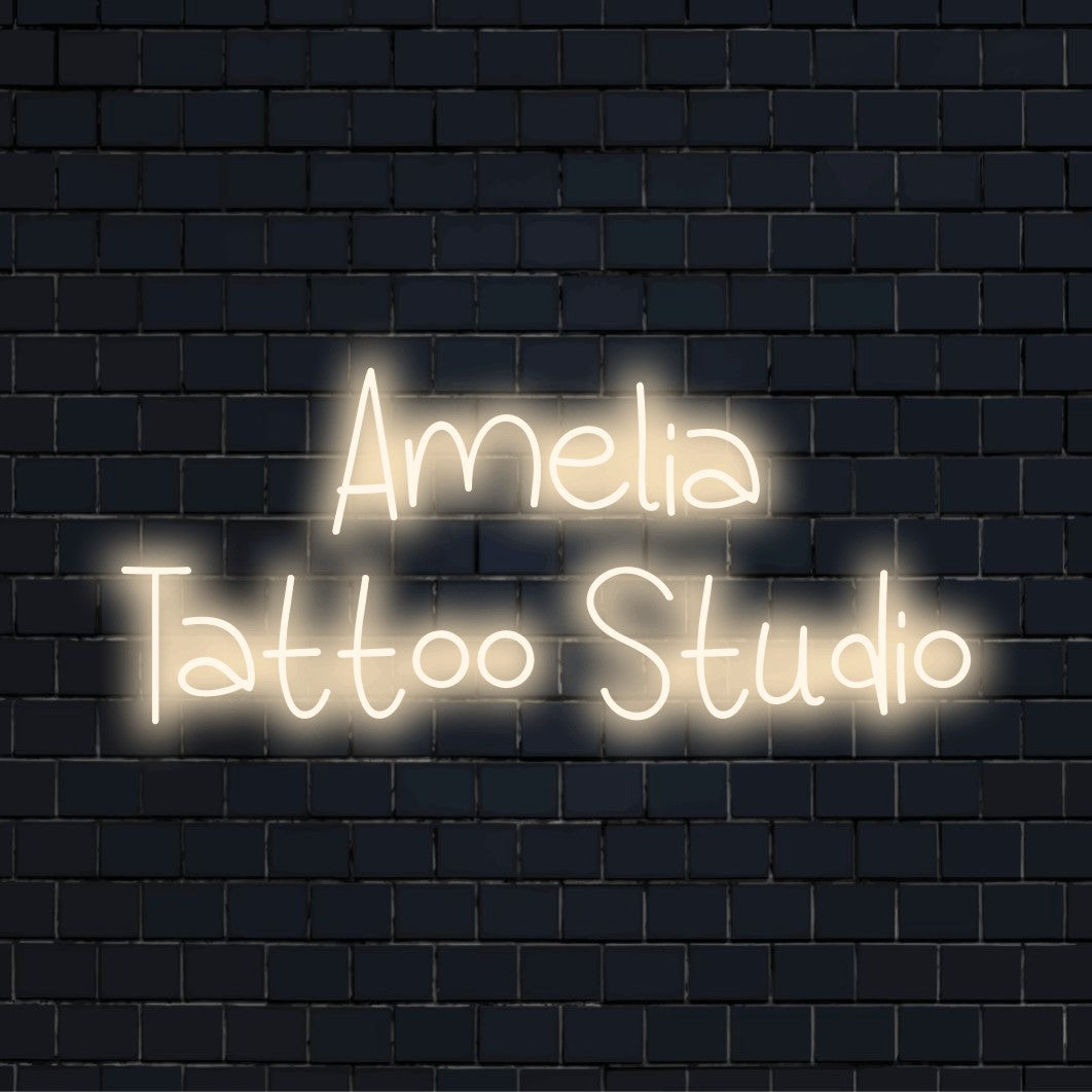 Amelia Tattoo Studio Personalized LED Neon Sign, soft neon glow on black brick background
