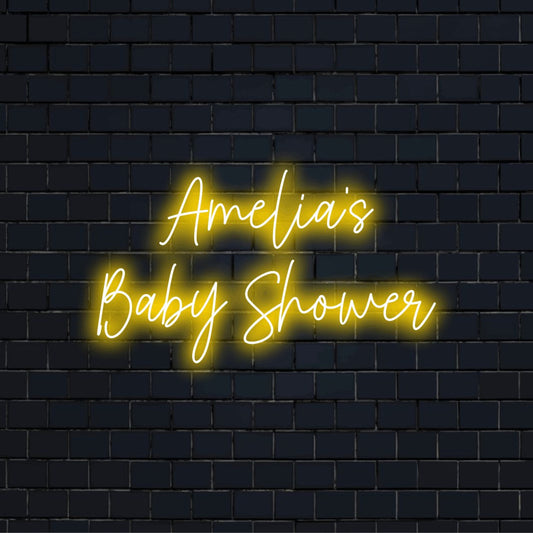 Amelia_s Baby Shower Custom Name Neon Sign, bright neon lettering on black brick background