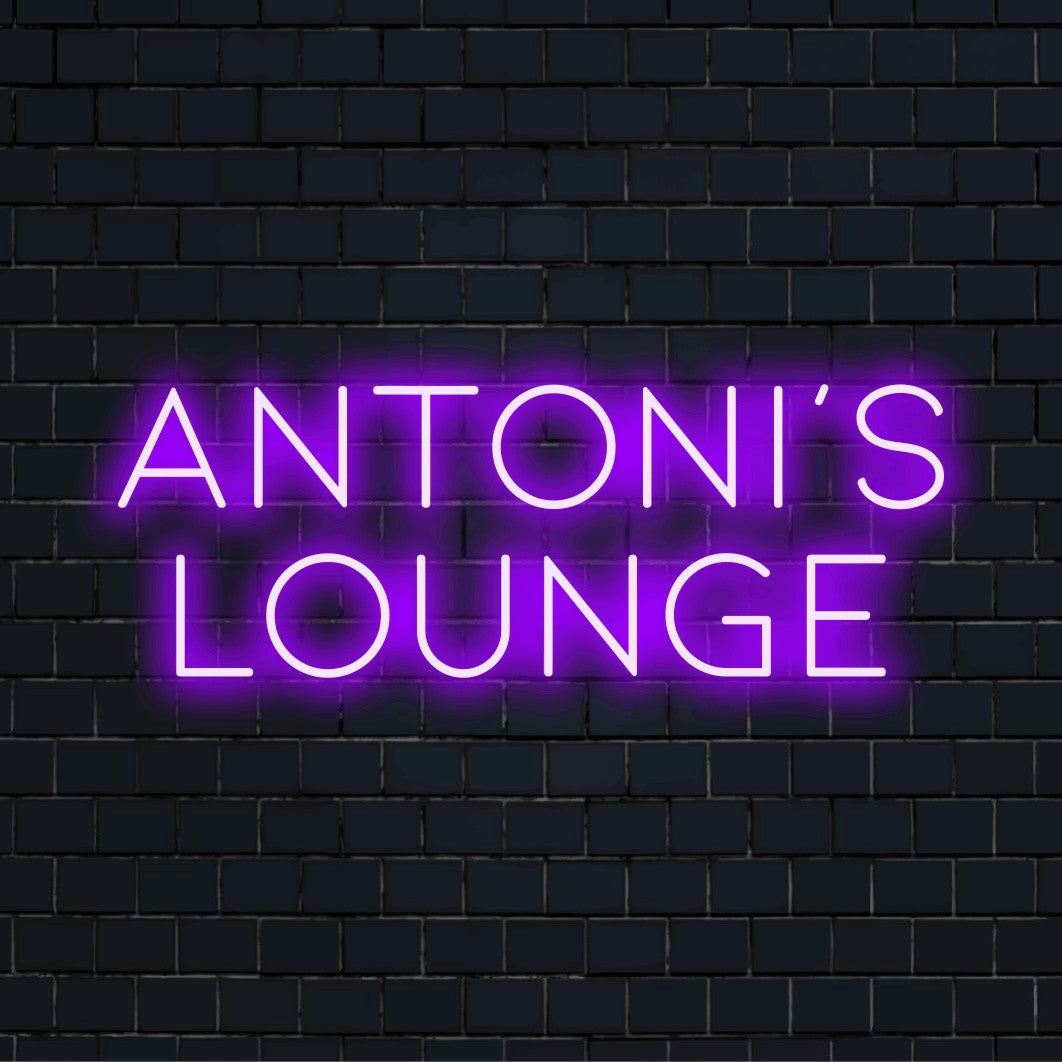 Antoni_s Lounge Personalized LED Neon Sign, glowing neon text on dark brick wall