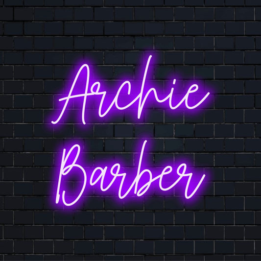 Archie Barber Custom Name Neon Sign, neon text light against brick backdrop