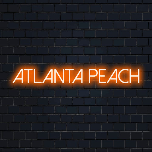 Atlanta Peach Neon Sign, bright LED glow on black brick background