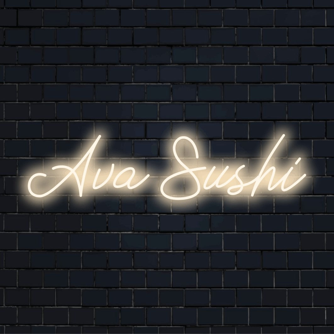 Ava Sushi Personalized Neon Light with glowing neon text on dark brick wall